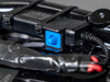 Close-up of the blue On/Off/Auto rotary dial on the Quad Lock 12V adaptor, cable-tied down beside its red battery lead